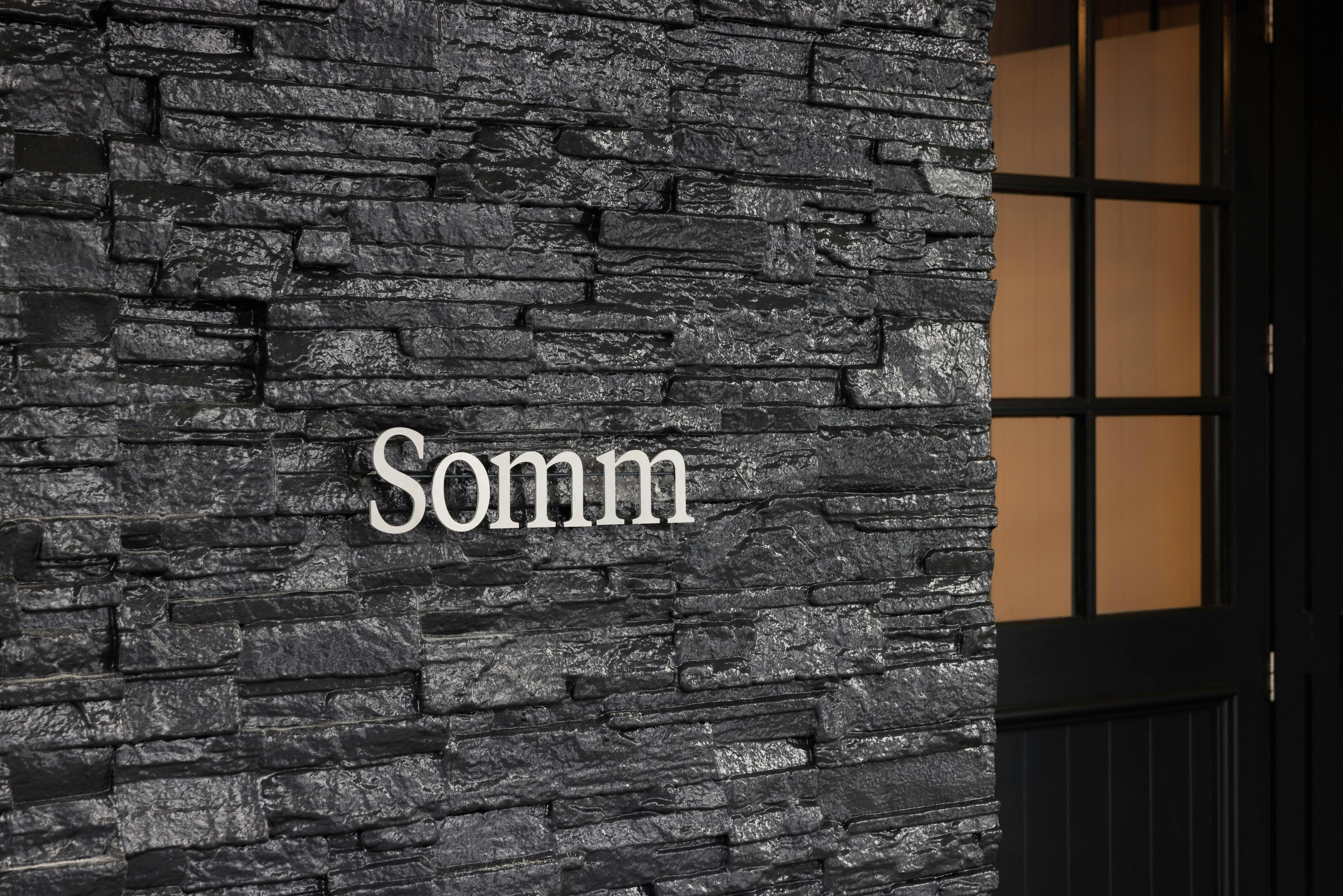 Custom CNC Somm sign on brick wall